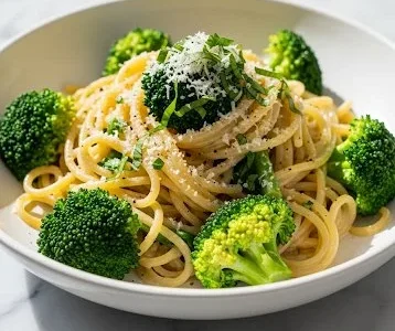 Light and healthy broccoli pasta dish topped with fresh ingredients